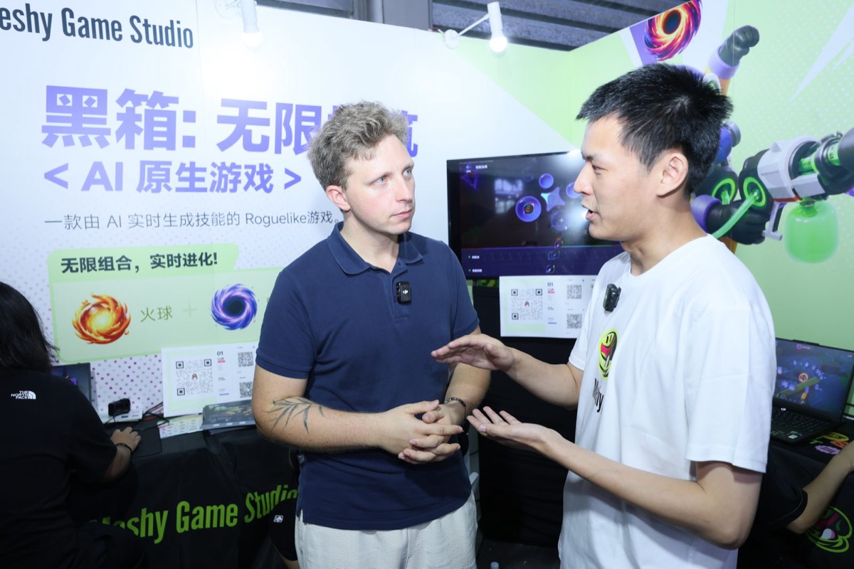 Wojciech Jaworski talking with a Chinese developer at ChinaJoy 2026 in Shanghai